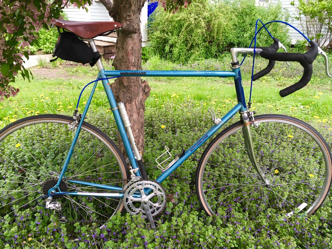 A blue Motobecan Jubilee Sport bicycle