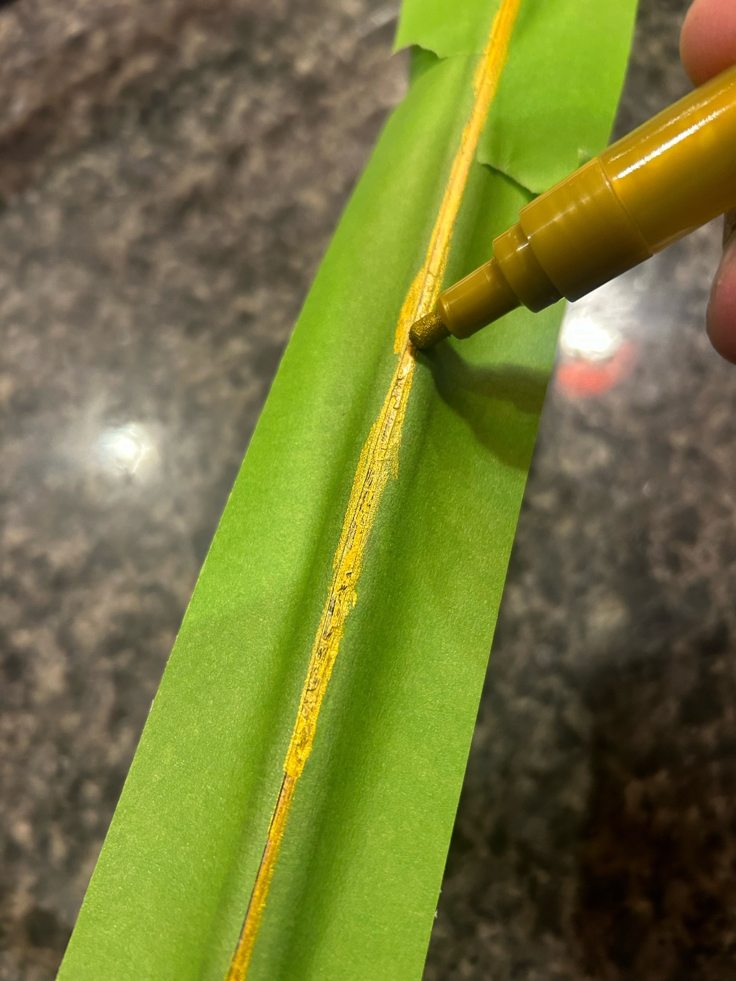 Repainting the gold pinstripes